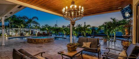 Pool & Hot Spa, gorgeous Cabana with seating looking over the water.