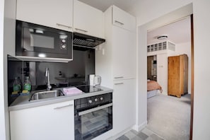Kitchen has everything you could need to create a nice meal for two.
