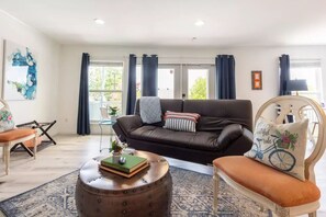 Spacious leather futon. Plenty of natural light. Walk out to the private balcony