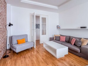 Bedroom with a street view - sofa