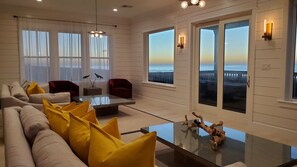 1st Floor:  Living room and sun rises on the Gulf 