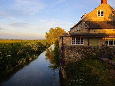 Riverbank location with views across the somerset levels to the mendip hills.