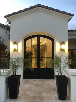 The elegant 9' custom-designed doors greet you and your guests so graciously.