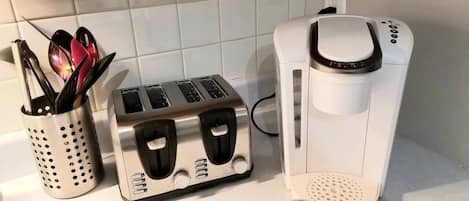 Keurig coffee maker & coffee pods. Toaster and kitchen utensils. 