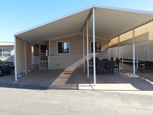 Front of house with 2-car parking and dining area