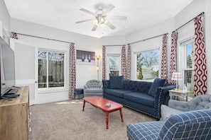 Bright and airy living room with plenty of seating.