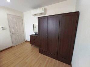 Big cabinet and 18000 BTU air condition, electric fan.