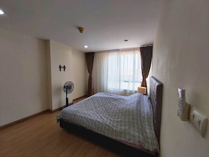 King bed - soft & dark curtains and 18000 BTU air condition, electric fan.
