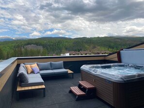 The private rooftop hot tub is the perfect place to spend summer nights