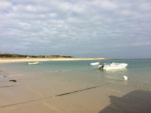 Longis Beach with house and cottage in background