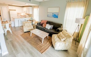 Living area flows into dining and kitchen