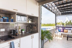Sliding doors close off the bedroom, and room-darkening blinds roll down to keep out the sun