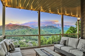 Stunning mountain views rain or shine on our covered deck!