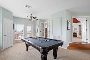 The full-size pool table in the game room
