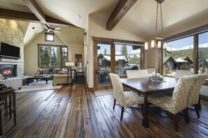 Dining area and living room in the background of Luxury Breckenridge Vacation Home