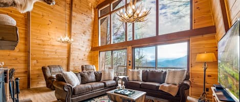 Living room has two story windows with stunning views of the Smoky Mountains!