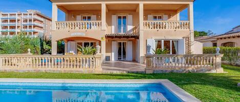 Facade and pool of Villa Lago in Alcudia, Mallorca