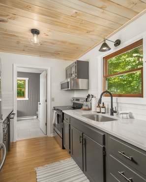 Updated kitchen with new appliances and and stocked with cooking essentials