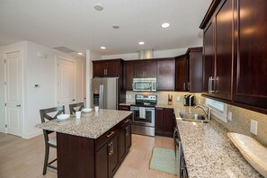 The granite and stainless kitchen is large with an island and seating for 2...gorgeous!