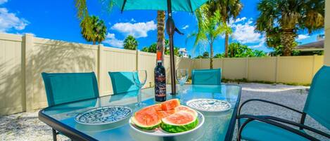 Outdoor dining for 6 under the shade.  Enjoy some wine and watermelon anytime!