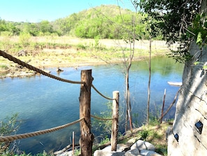 Just 30 yards from the cabin, steps cut into the bluff guide you to Sylamore Creek