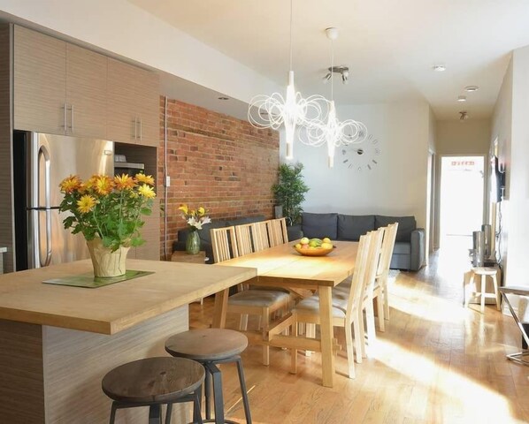 The dining table sits 10 people and the kitchen island sits 2 people.