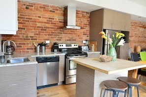 The kitchen has all appliances including a dishwasher.