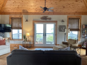 Main room; french doors open to screened porch.