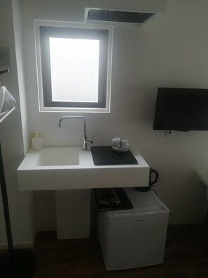It is a picture of a mini kitchen