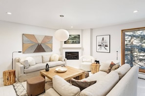 The gas fireplace and flat screen TV are enjoyed from the comforts of the welcoming living area.