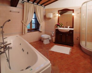 Bathroom with bath and shower