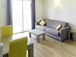 Furniture, Room, Property, Interior Design, Living Room, Floor, Yellow, Laminate Flooring, Wall, Building