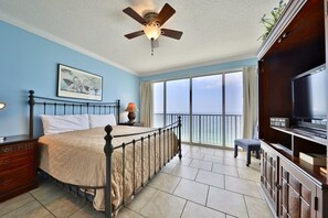 Gulf front master bedroom with flatscreen TV.