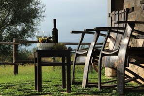 Wooden chairs in front of the Cottage. 