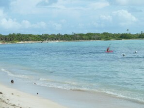 Protected by a large reef, the bay is ideal for kayaking, swimming & snorkeling