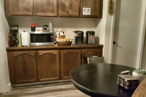 Common room area with microwave, coffee maker, and prepackaged snacks