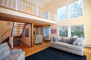 Living room is open to second floor loft