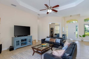 Living Room with TV and View of the Pool/Patio