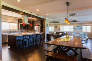 Another view of the dining room and table that seats 16+. Seating at the kitchen counter too.