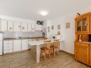 Flooring, Furniture, Interior Design, Wood, Kitchen, Floor, Cabinetry, Ceiling, Countertop, Room