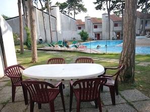 Plant, Furniture, Table, Tree, Building, Chair, Window, Sky, Leisure, Grass