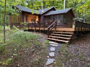 Short gently sloping rock path from the beach to the  cottage .