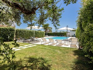 Plant, Sky, Plant Community, Shade, Outdoor Furniture, Land Lot, Vegetation, Tree, Urban Design, Real Estate