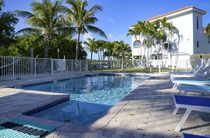 Large Fenced in Pool with Lounge Seating