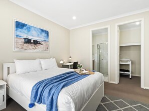 Master bedroom located at the front of the house for privacy and separation from the rest of the house. Baby change table, portacot and desk provided for your convenience.