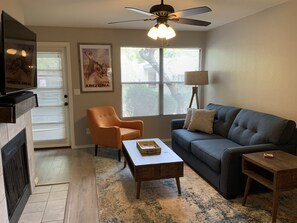 The living room...this is a sleeper sofa and the 55” HD TV has a sound bar.
