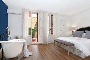 Ensuite master bedroom with vintage bath and direct exit to the terrace