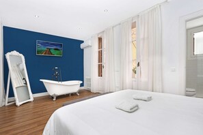 Ensuite master bedroom with vintage bath and direct exit to the terrace