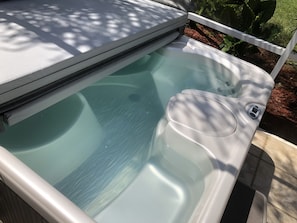 CC21040 - The screened in patio is equipped with a hot tub to fully relax in at the end of a fun filled day and enjoy the view!