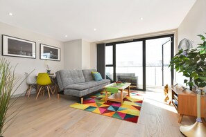 Spacious comfy open plan kitchen lounge with a south facing balcony